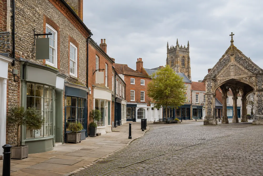 Flint and red brick commercial buildings on a Norfolk market town street