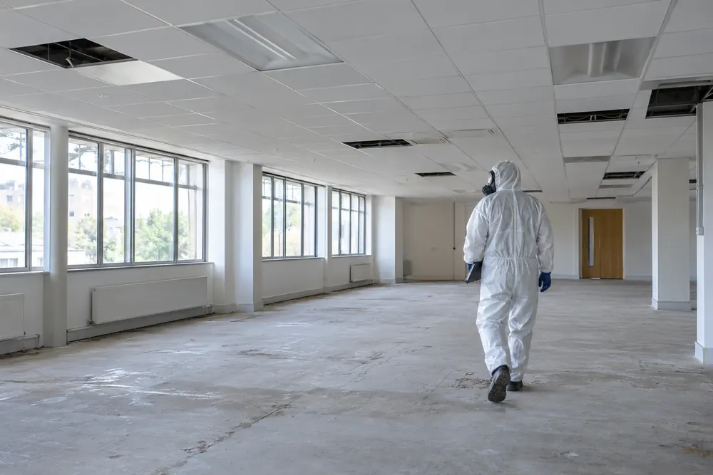Isolated commercial interior prepared for an intrusive survey with a protected surveyor
